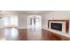 Inviting living room with hardwood floors and fireplace, filled with natural light at 10528 Sw 27Th Ave, Ocala, FL 34476