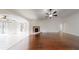 Spacious living room with hardwood floors, fireplace and ceiling fan at 10528 Sw 27Th Ave, Ocala, FL 34476