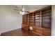 Stylish office with custom wood shelving and hardwood flooring offering storage and charm at 10528 Sw 27Th Ave, Ocala, FL 34476