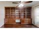 Cozy office space showcasing custom built-in wooden shelving and drawers, and hardwood floors at 10528 Sw 27Th Ave, Ocala, FL 34476