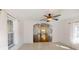 Sun room featuring bright windows overlooking a hardwood floor hallway at 10528 Sw 27Th Ave, Ocala, FL 34476