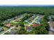 An aerial view of the community showcases lush landscaping and mature trees at 11586 Sw 75Th Cir, Ocala, FL 34476