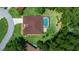 The property has a screened-in pool, mature trees, and well-maintained landscaping at 11586 Sw 75Th Cir, Ocala, FL 34476