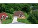 An aerial view of the property featuring a well-manicured lawn and mature landscaping at 11586 Sw 75Th Cir, Ocala, FL 34476