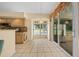 Cozy breakfast nook adjacent to kitchen features slider doors at 11586 Sw 75Th Cir, Ocala, FL 34476
