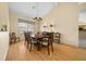 Traditional dining room features wood floors, vaulted ceilings and chandelier lighting at 11586 Sw 75Th Cir, Ocala, FL 34476