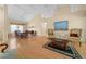 Elegant living and dining room with hardwood floors, large windows, and neutral tones at 11586 Sw 75Th Cir, Ocala, FL 34476