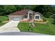 Charming single-story home with well-manicured lawn and attached two-car garage at 11586 Sw 75Th Cir, Ocala, FL 34476