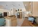 Open kitchen with granite counters, stainless appliances, and tiled flooring at 11586 Sw 75Th Cir, Ocala, FL 34476