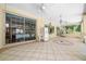 A generously sized covered lanai with tiled flooring, perfect for relaxation and entertaining at 11586 Sw 75Th Cir, Ocala, FL 34476