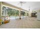 Spacious covered lanai with tile flooring, offering an inviting space for relaxation and outdoor enjoyment at 11586 Sw 75Th Cir, Ocala, FL 34476