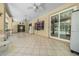 An expansive covered lanai with tiled flooring, ideal for relaxation and enjoying outdoor living at 11586 Sw 75Th Cir, Ocala, FL 34476