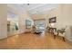 Bright and airy living room with hardwood floors and sliding glass doors to the pool at 11586 Sw 75Th Cir, Ocala, FL 34476