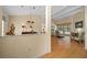 Open-concept living room and dining area with vaulted ceilings and hardwood floors at 11586 Sw 75Th Cir, Ocala, FL 34476