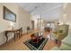 Inviting living room showcasing hardwood floors, high ceilings and traditional decor at 11586 Sw 75Th Cir, Ocala, FL 34476