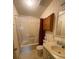 Traditional bathroom with tub and vanity at 1408 Torrey Pines Dr, Lady Lake, FL 32159