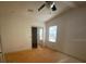 Bedroom features ceiling fan, natural light, and a mirrored closet at 1408 Torrey Pines Dr, Lady Lake, FL 32159