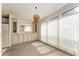 Bright dining area with classic built-ins, pendant lighting, and abundant natural light at 1408 Torrey Pines Dr, Lady Lake, FL 32159