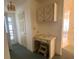 Hallway featuring storage, doors, and a desk at 1408 Torrey Pines Dr, Lady Lake, FL 32159