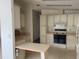 Vintage kitchen featuring classic cabinetry, stove, and ample counter space at 1408 Torrey Pines Dr, Lady Lake, FL 32159