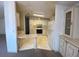 Functional kitchen with white cabinets and standard appliances offers a practical cooking space at 1408 Torrey Pines Dr, Lady Lake, FL 32159