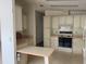 Functional kitchen with white cabinets and a cozy eat-in area at 1408 Torrey Pines Dr, Lady Lake, FL 32159
