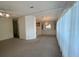 Spacious living area open to dining and kitchen, featuring modern lighting at 1408 Torrey Pines Dr, Lady Lake, FL 32159