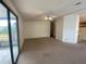 Open-concept living space with access to the screened in patio at 1408 Torrey Pines Dr, Lady Lake, FL 32159