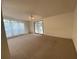 Open-concept living space with a ceiling fan and large windows at 1408 Torrey Pines Dr, Lady Lake, FL 32159