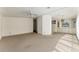 Spacious carpeted living area with a ceiling fan and a view into the adjacent dining space at 1408 Torrey Pines Dr, Lady Lake, FL 32159