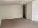 Neutral living room with a ceiling fan and entry into another room at 1408 Torrey Pines Dr, Lady Lake, FL 32159