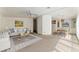 Open-concept living and dining area with neutral color palette, ceiling fan, and lots of natural light at 1408 Torrey Pines Dr, Lady Lake, FL 32159