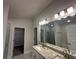 Bright bathroom boasts double sink vanity, granite countertop, and shower/tub combo at 15106 Se 94Th Ter, Summerfield, FL 34491