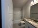 Bathroom features granite counters, shower over tub and tiled floor at 15106 Se 94Th Ter, Summerfield, FL 34491