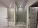 Bathroom featuring separate shower and tub, tile flooring, and neutral wall colors at 15106 Se 94Th Ter, Summerfield, FL 34491