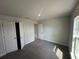 Bedroom with neutral carpet, and window providing natural light at 15106 Se 94Th Ter, Summerfield, FL 34491