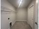 Walk-in closet with a wire shelf and gray tiled floor at 15106 Se 94Th Ter, Summerfield, FL 34491