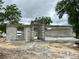 A partially constructed home shows block walls, door and window openings amid a sandy construction site at 15106 Se 94Th Ter, Summerfield, FL 34491