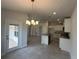 Open kitchen showcases an island, tile floors, recessed lighting, and stainless steel appliances at 15106 Se 94Th Ter, Summerfield, FL 34491