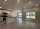 Open concept with island kitchen, dining area, and views to the backyard at 15106 Se 94Th Ter, Summerfield, FL 34491