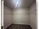 Empty walk-in closet featuring carpeted flooring and metal shelving at 15106 Se 94Th Ter, Summerfield, FL 34491