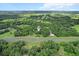 Expansive aerial view of a wooded property showcasing its privacy and natural surroundings at 16120 Nw Us Highway 27, Williston, FL 32696
