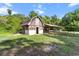 This property features a barn with an attached structure at 16120 Nw Us Highway 27, Williston, FL 32696