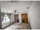 View of empty bedroom with fan, window, and empty closet at 16120 Nw Us Highway 27, Williston, FL 32696