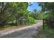 This gated driveway leads to a private estate at 16120 Nw Us Highway 27, Williston, FL 32696