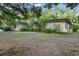 A single-story house with a brick exterior and mature landscaping at 16120 Nw Us Highway 27, Williston, FL 32696