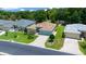 Aerial view of a well-maintained home with a spacious yard, lush landscaping, and a long driveway at 16193 Sw 14Th Avenue Rd, Ocala, FL 34473