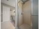 Tiled bathroom features a glass-enclosed shower stall, neutral decor, and well-maintained fixtures at 16193 Sw 14Th Avenue Rd, Ocala, FL 34473