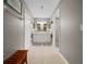 Hallway view of a spacious bathroom featuring dual sinks, ample counter space, and a separate shower at 16193 Sw 14Th Avenue Rd, Ocala, FL 34473