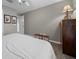 Serene bedroom featuring wood-look floors, minimalist decor, and soft lighting at 16193 Sw 14Th Avenue Rd, Ocala, FL 34473